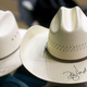 Two large white cowboy hats
